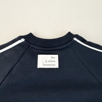 Macacão Bebê Moletom Peluciado Comfy – Preto com Off White